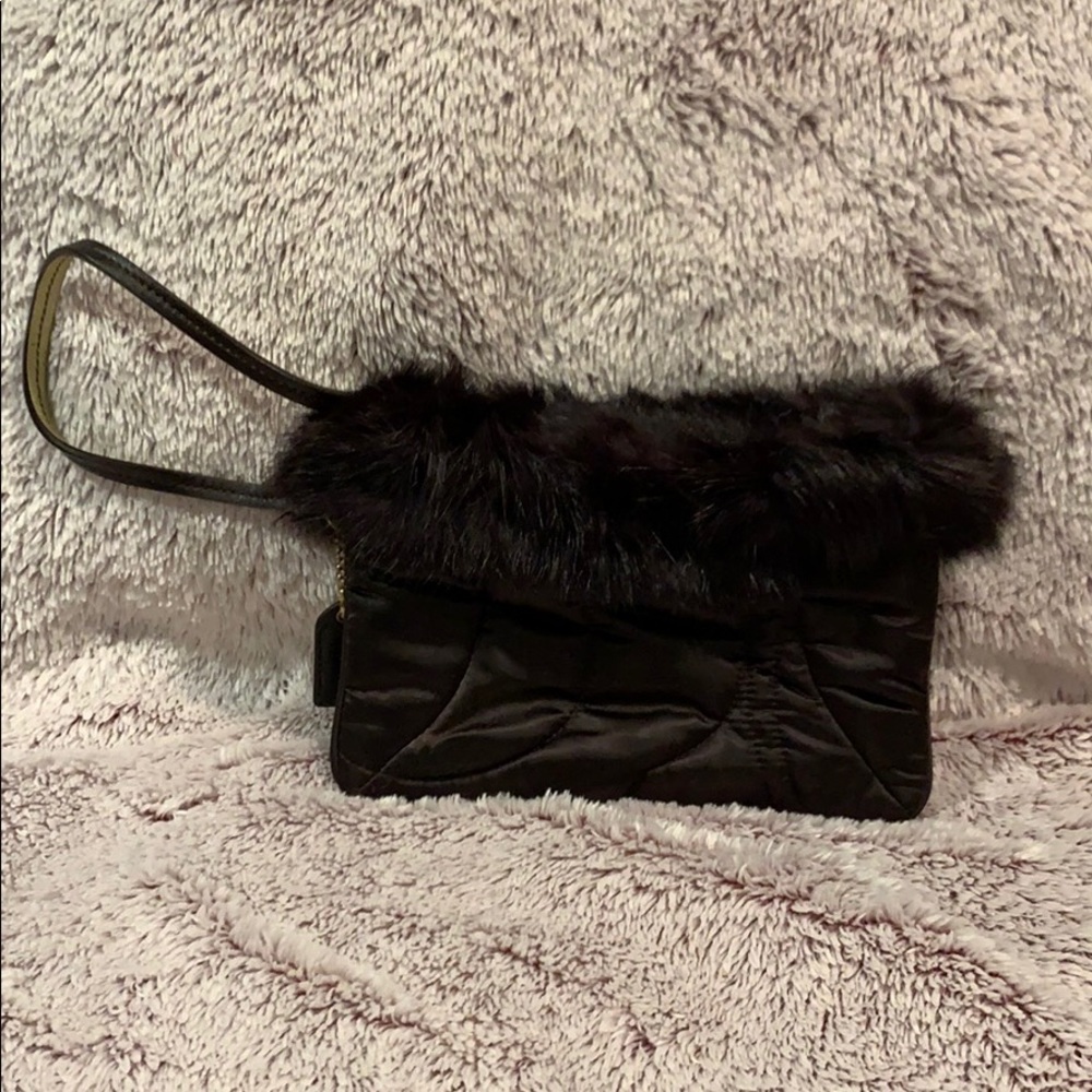 Brown coach wristlet with fur